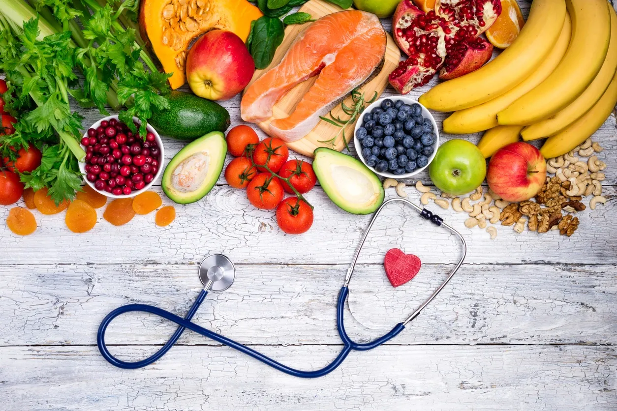 a group of fruits and vegetables with a stethoscope