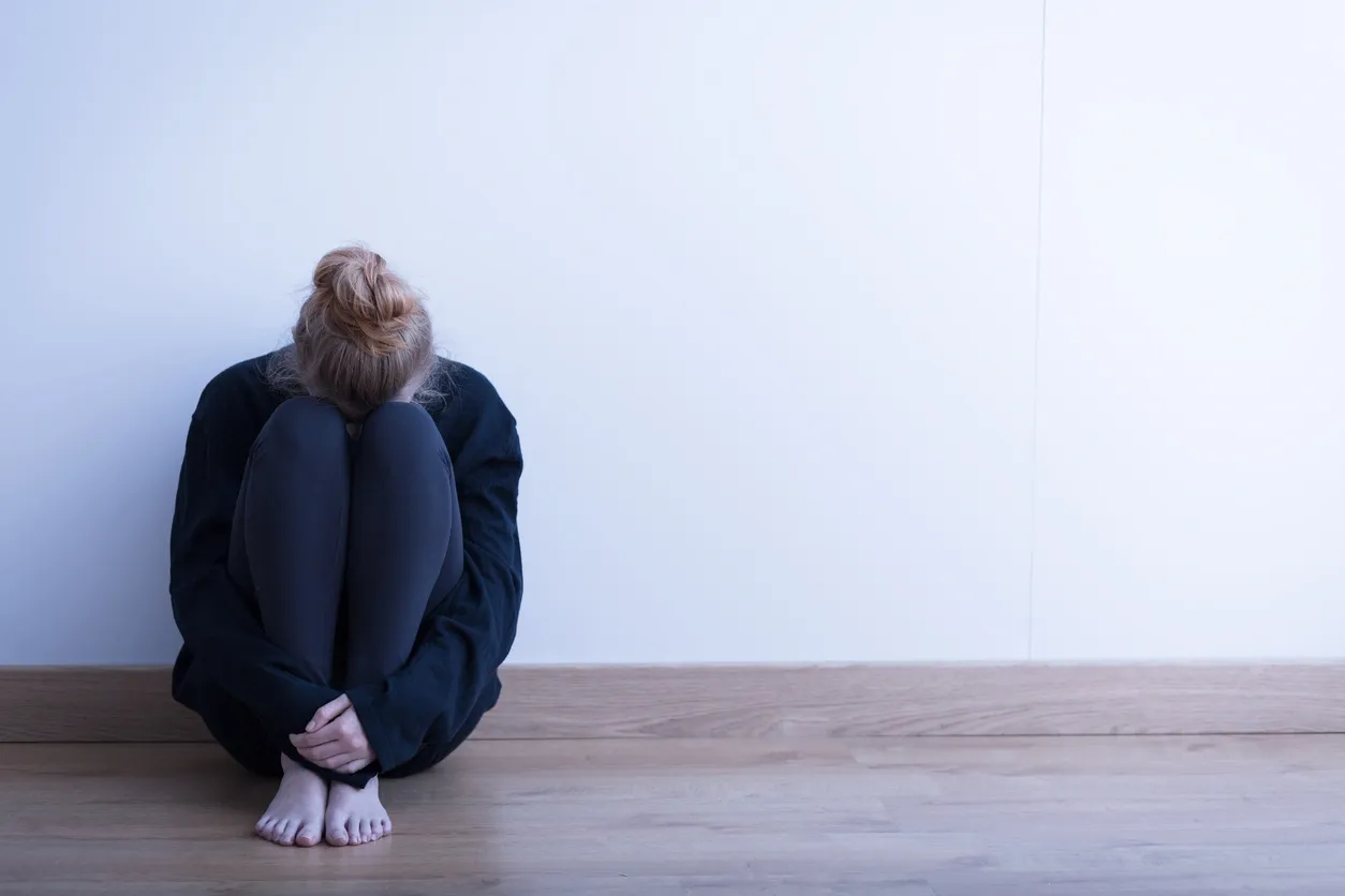 a woman sitting on the floor