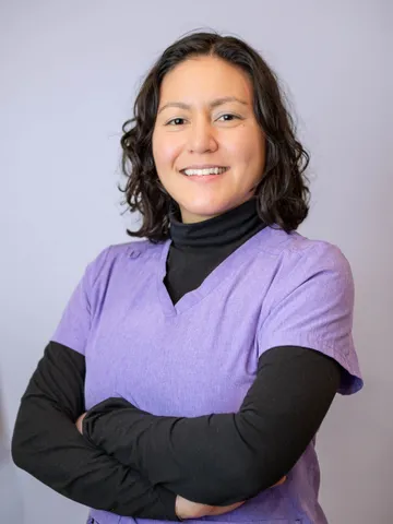 a woman in a purple shirt