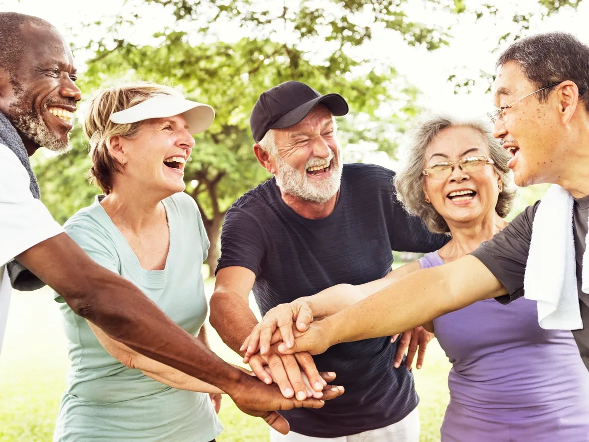 a group of people holding hands together