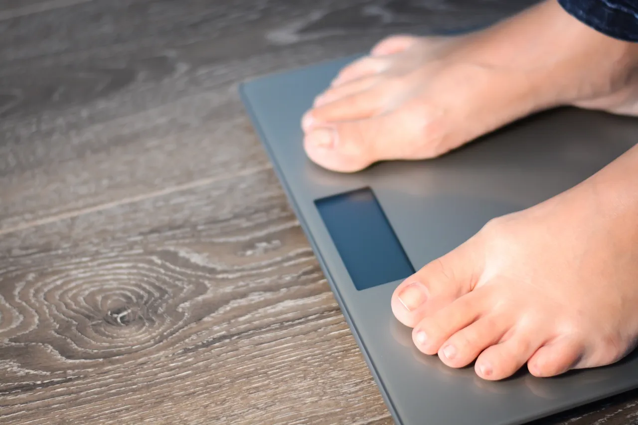 a person's feet on a scale