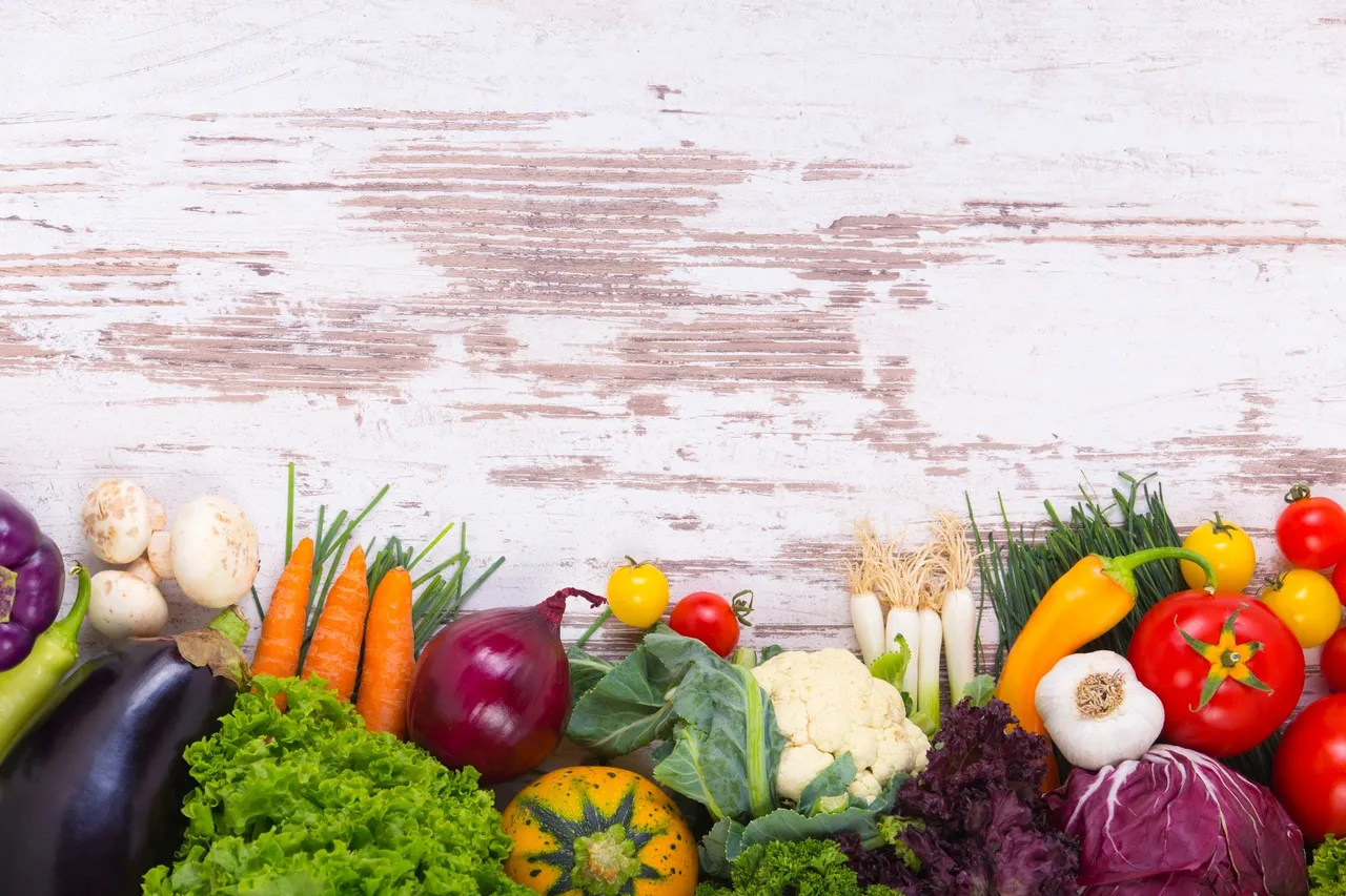 a group of vegetables on a white surface