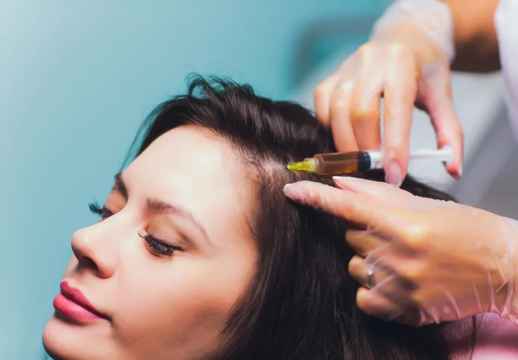 a woman getting her hair done - prp scaled