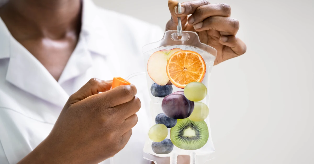 Healthcare provider giving a fruit-infused IV Therapy drip in Olympia, WA clinic