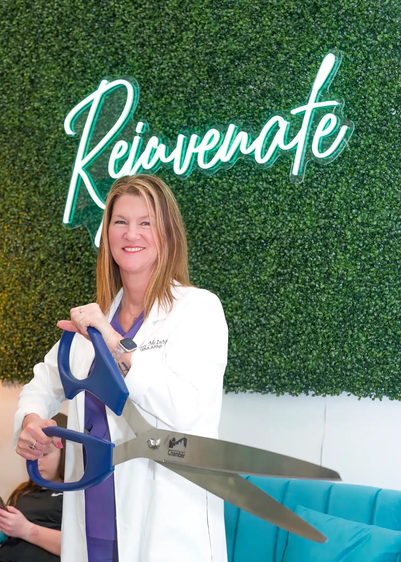 a woman holding a pair of scissors