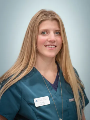 a woman wearing a blue scrubs - cassi