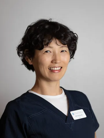 a woman smiling for a picture - myounghee