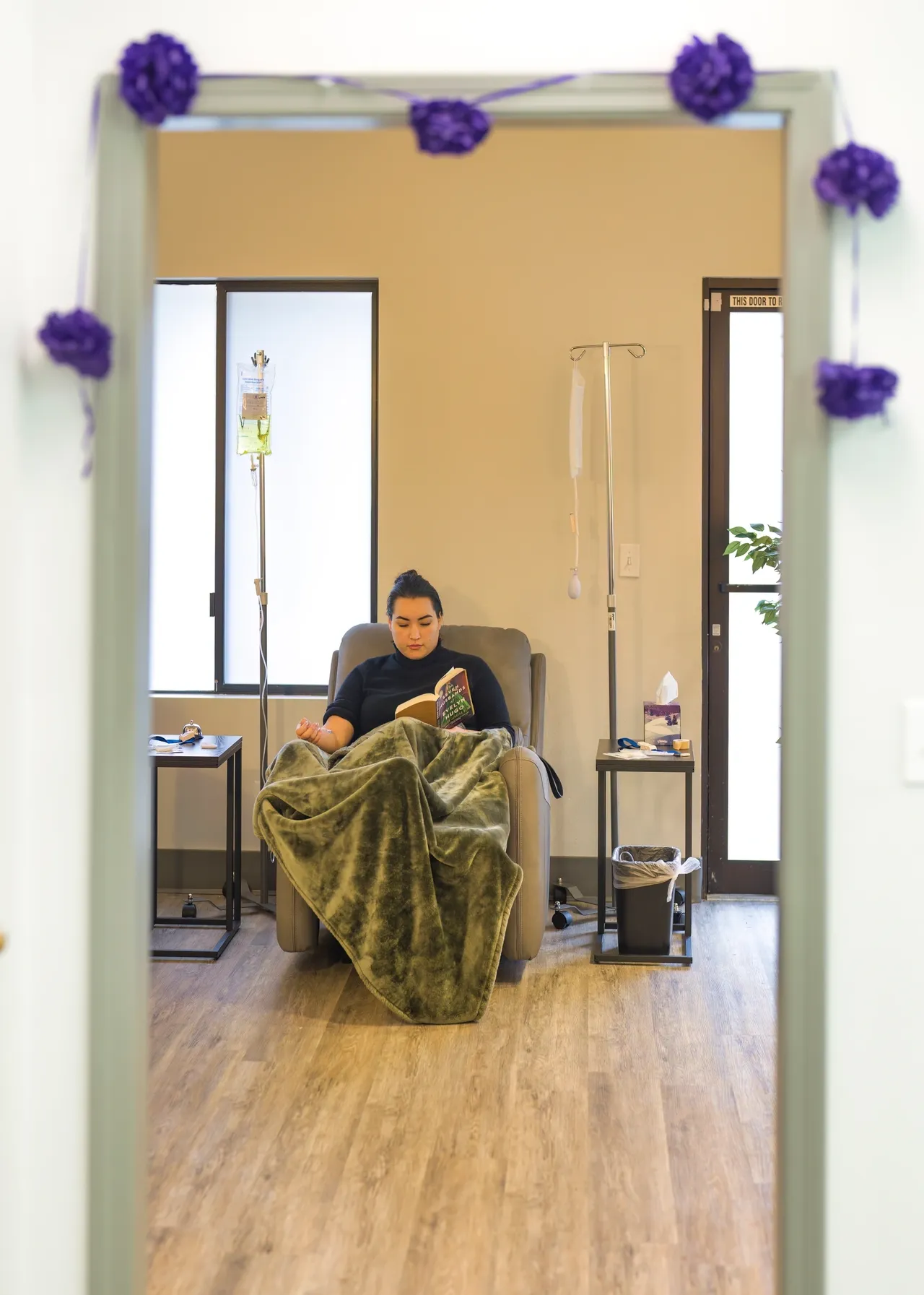 a woman sitting in a chair with a blanket on her lap - rs=w_1280,h_1793 (2)