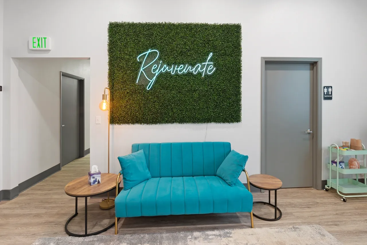 a blue couch and two end tables in front of a green wall - rs=w_1280,h_854 (2)